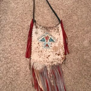 Cowhide fringe purse